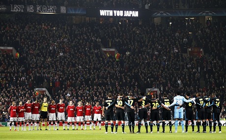 Manchester United and Marseille players observe a minutes silence in memory of the Japanese earthquake victims ahead of the UEFA Champions League round of 16 second leg match between Manchester United and Marseille at Old Trafford on March 15, 2011 in Manchester, England.