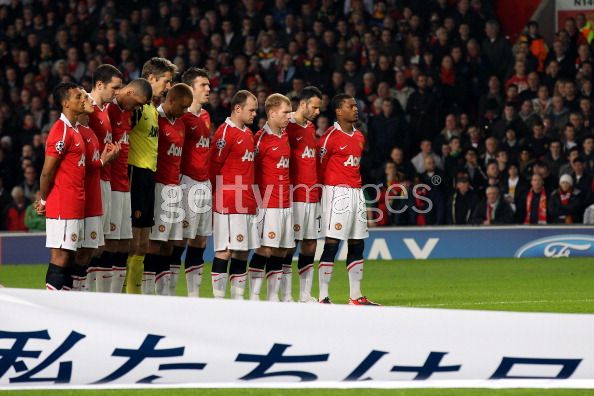 Manchester United players observe a minutes silence in memory of the Japanese earthquake victims ahead of the UEFA Champions League round of 16 second leg match between Manchester United and Marseille at Old Trafford on March 15, 2011 in Manchester, England.